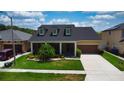 Charming single-Gathering home with a well-maintained lawn and landscaped garden at 1723 Brassie Ct, Kissimmee, FL 34746