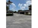 View of the community featuring parking, landscaping, and well-maintained exteriors at 1844 Townhall Ln # 1844, Orlando, FL 32807