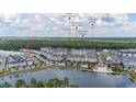 Aerial view of community near lake, shops, and restaurants at 2057 Celebration Blvd, Kissimmee, FL 34747