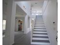 A bright staircase leads to the second floor at 257 Lancaster Dr, Davenport, FL 33897
