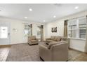 Bright living room with neutral-toned furniture and large windows for natural light at 341 Lasso Dr, Kissimmee, FL 34747