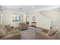 Open-concept living area with staircase, seamlessly connecting to the kitchen at 341 Lasso Dr, Kissimmee, FL 34747
