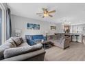Comfortable living room with large sectional sofa, ceiling fan, neutral walls, and an open floor plan at 5038 Tideview Cir # 21, Orlando, FL 32819