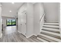 Foyer with hardwood floors and stairs at 1628 Portofino Meadows Blvd, Orlando, FL 32824