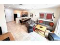 Inviting living room featuring tile flooring, comfortable seating, and modern decor at 3014 Red Ginger Rd, Kissimmee, FL 34747