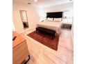 Comfortable bedroom with a large mirror, neutral tones, and ambient lighting at 3014 Red Ginger Rd, Kissimmee, FL 34747
