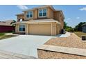 Lovely home with a spacious driveway and well-maintained landscaping at 315 Wildflower Rd, Davenport, FL 33837