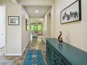 Inviting foyer featuring tile flooring, stylish decor, and views into the bright and airy living spaces at 582 San Joaquin Rd, Kissimmee, FL 34759