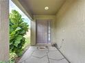 Charming front entrance with decorative plants and a unique stone walkway at 1364 Rebecca Dr, Haines City, FL 33844