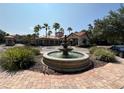 Beautiful fountain in front of building with palm trees and brick walkway creates a welcoming ambiance at 1375 Tuscana Ln # 1405, Davenport, FL 33896