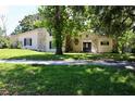 Charming home with stone accents, mature trees, and a well-manicured lawn for curb appeal at 1843 Harbor Blvd, Kissimmee, FL 34744