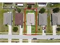 Aerial view of a single Gathering home with well maintained yard and a driveway at 3030 Eagle Crossing Dr, Kissimmee, FL 34746