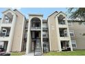 The exterior shows stairs and multiple balconies to the condos in the building at 4728 Walden Cir # 32, Orlando, FL 32811