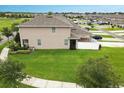 Aerial view of a spacious backyard with a well-maintained lawn and partial fencing at 4800 Riverwalk Dr, St Cloud, FL 34771