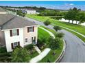 Charming two-story townhome with lush landscaping on a corner lot near a pond at 4800 Riverwalk Dr, St Cloud, FL 34771
