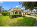 Well-maintained home with lush green lawn and mature landscaping enhancing curb appeal at 9128 Stromboli Ct, Kissimmee, FL 34747