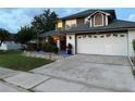 Charming two-story house with a spacious driveway and a well-manicured lawn at 11922 Ottawa Ave, Orlando, FL 32837