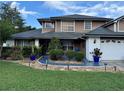 Well-maintained two-story home featuring a landscaped front yard and a two-car garage at 11922 Ottawa Ave, Orlando, FL 32837