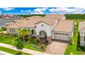 A high angle view of the home's architecture, landscaping, rooflines, and the neighborhood at 13809 Abberwick Dr, Orlando, FL 32832