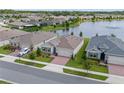 New home boasts waterfront views, lush landscaping and a prime location within a vibrant community at 17795 Blazing Star Cir, Clermont, FL 34714