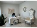 Bright home office with a large desk, comfortable chair, and decorative accents at 1896 Basenji Dr, Lake Alfred, FL 33850