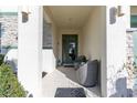Inviting front porch with seating, offering a cozy and welcoming entrance to the home at 2623 Calistoga Ave, Kissimmee, FL 34741