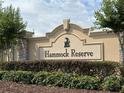 Attractive entrance sign for Hammock Reserve community in a landscaped setting at 3476 Yarian Dr, Haines City, FL 33844