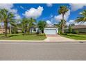 Beautiful single-Gathering home featuring a manicured lawn and two-car garage at 3606 Solana Cir, Clermont, FL 34711