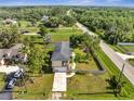 Aerial view of property showcasing a large lot with mature trees and neighborhood at 4899 Meadow Dr, St Cloud, FL 34772