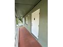 Apartment entry featuring a white door with a small porch and railing at 702 Michigan Ct # 4, St Cloud, FL 34769
