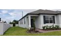 Charming single-story home with a manicured lawn and neat landscaping at 1292 Hilltop Pl, St Cloud, FL 34772