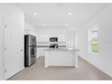 Modern kitchen features sleek stainless steel appliances and granite countertops, perfect for cooking at 2860 Poppy Avenue, Haines City, FL 33844