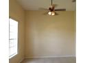Comfortable bedroom with natural light, a ceiling fan, neutral wall color, and tile flooring at 3074 Bay Laurel N Cir, Kissimmee, FL 34744