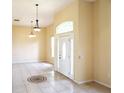 Bright entryway featuring tile flooring, a decorative medallion and a glass front door and sidelights allowing ample natural light at 3074 Bay Laurel N Cir, Kissimmee, FL 34744