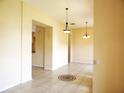Spacious living room featuring tile flooring and neutral paint, offering a versatile space for relaxation and entertainment at 3074 Bay Laurel N Cir, Kissimmee, FL 34744