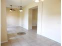 Open-concept space showcasing tile flooring and neutral paint, creating a welcoming atmosphere for comfortable living and gatherings at 3074 Bay Laurel N Cir, Kissimmee, FL 34744