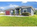 Charming one-story house featuring a well-kept lawn and an attached two-car garage at 3292 Sw 133Rd Lane Rd, Ocala, FL 34473