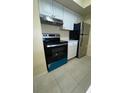 Efficient kitchen with updated appliances and clean white cabinetry at 429 Fountainhead Cir # 223, Kissimmee, FL 34741