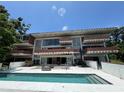 Striking multi-story home with an inviting pool and outdoor staircase at 550 Lake Otis Se Dr, Winter Haven, FL 33880