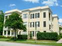 Well-maintained multi-story residential building with classic architectural details and mature trees at 920 Spring Park St # 301, Celebration, FL 34747