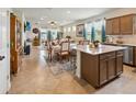 Spacious, open concept living and dining area featuring tiled floors and natural light from rear glass doors at 1895 Spring Shower Cir, Kissimmee, FL 34744