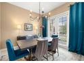 Formal dining room featuring elegant lighting and ample seating at 1592 Castile St, Celebration, FL 34747