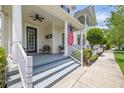 Inviting front porch with ceiling fans and comfortable seating area at 1592 Castile St, Celebration, FL 34747