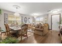 Inviting living room with hardwood floors, chandeliers, and elegant furniture at 1704 Pine Ridge Dr, Davenport, FL 33896