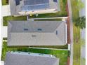 Aerial view showcases the roof and backyard of the property with manicured lawn at 178 Aberdeen St, Davenport, FL 33896
