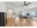 Spacious living room with wood floors and a large window, providing ample natural light at 2700 Palm Isle Way, Orlando, FL 32829