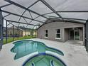 Beautiful screened-in pool and spa with patio, ideal for outdoor living and enjoying the sunshine at 350 Scrub Jay Way, Davenport, FL 33896