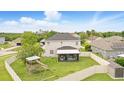 Expansive fenced backyard featuring a screened lanai, a playset, and lush green grass at 3859 Spirited Cir, St Cloud, FL 34772