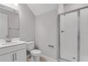 This bathroom features a walk-in shower, toilet, and vanity with neutral paint at 540 Summit River Dr, Apopka, FL 32712