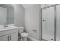 Clean bathroom with a walk-in shower, white cabinets, and a large mirror at 555 Summit River Dr, Apopka, FL 32712